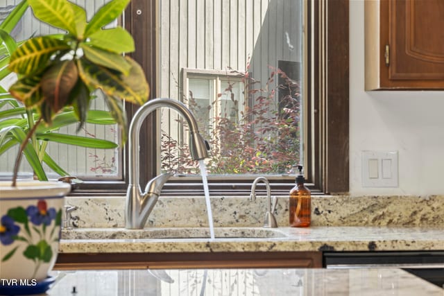 room details featuring light stone countertops