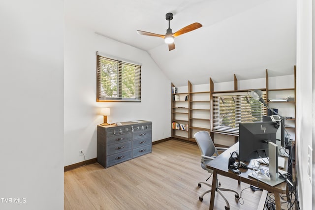 home office with light hardwood / wood-style floors, ceiling fan, and lofted ceiling