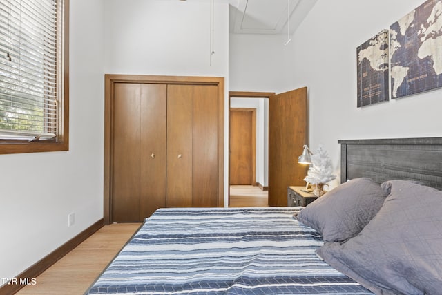 bedroom featuring light hardwood / wood-style flooring and a closet