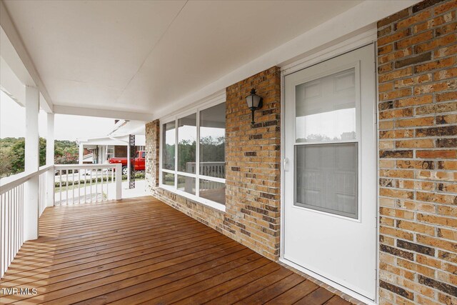 wooden deck featuring a porch