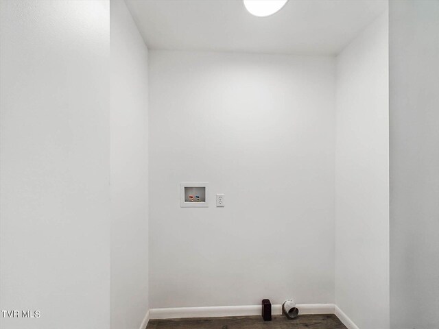 washroom featuring hookup for a washing machine and dark hardwood / wood-style flooring