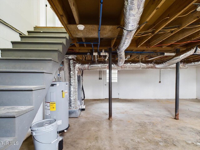 basement with water heater and heating unit