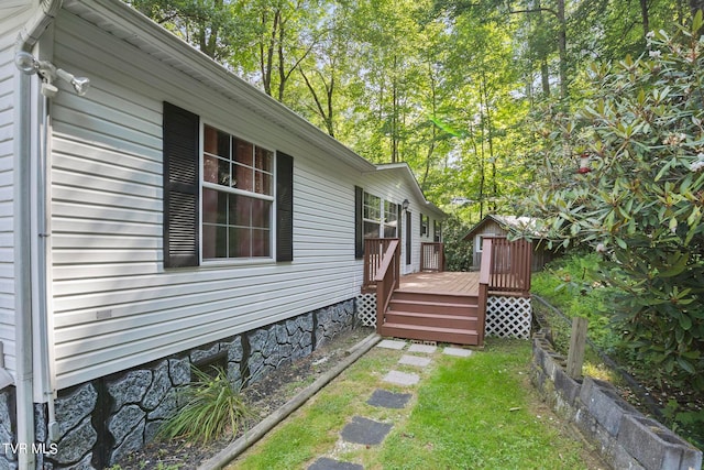 view of side of property featuring a deck