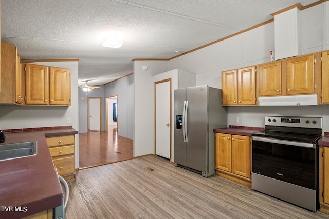 kitchen featuring exhaust hood, stainless steel appliances, ornamental molding, ceiling fan, and light wood-type flooring