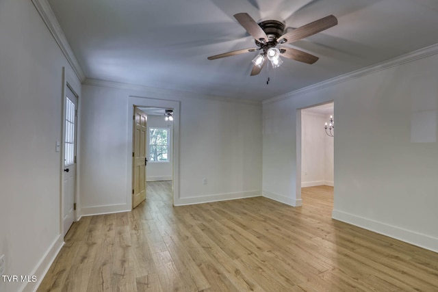 spare room with ceiling fan, crown molding, and light hardwood / wood-style flooring