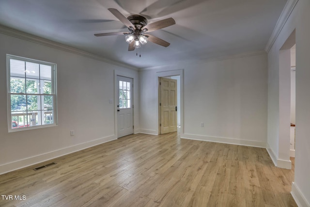 empty room with light wood-type flooring, ornamental molding, and ceiling fan