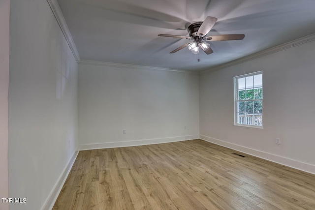 spare room with ceiling fan, ornamental molding, and light wood-type flooring