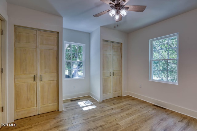 unfurnished bedroom with light hardwood / wood-style flooring and ceiling fan