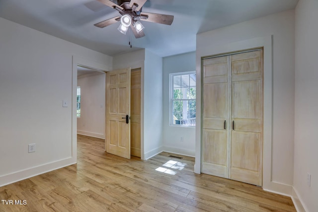 unfurnished bedroom featuring ceiling fan and light hardwood / wood-style floors