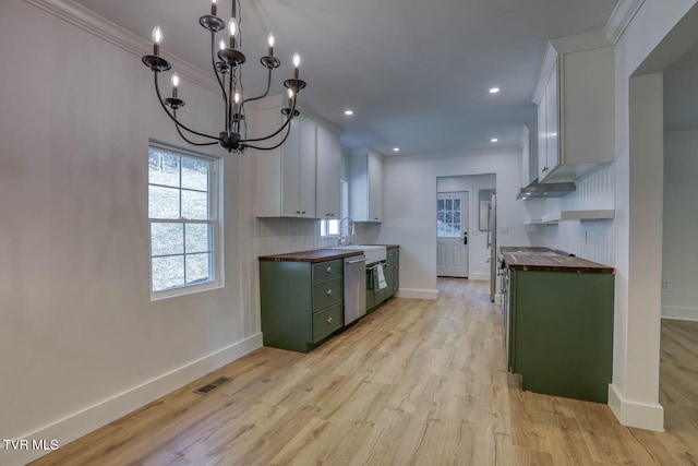 kitchen featuring wooden counters, a chandelier, white cabinets, and light hardwood / wood-style floors