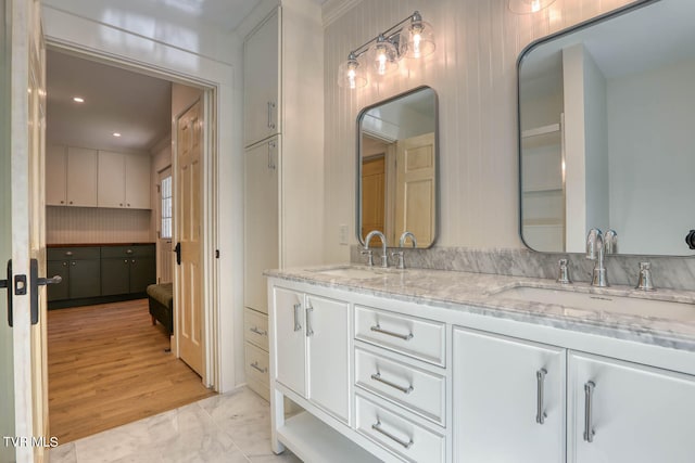 bathroom with wood-type flooring and vanity