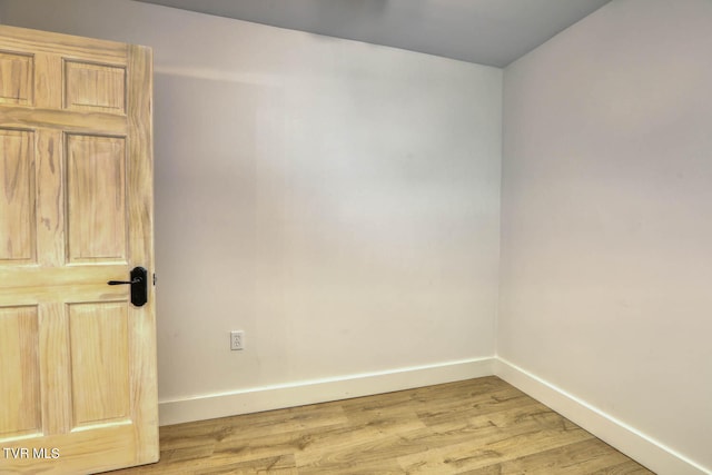 spare room with light hardwood / wood-style floors