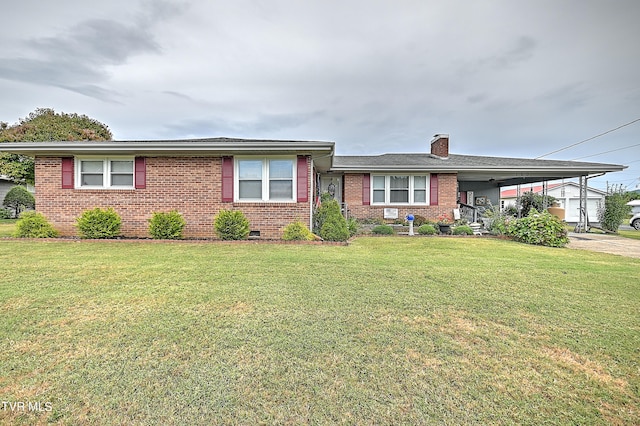 view of front facade with a front lawn and a carport