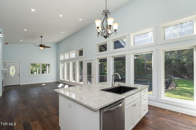 kitchen featuring dishwasher, sink, high vaulted ceiling, and plenty of natural light