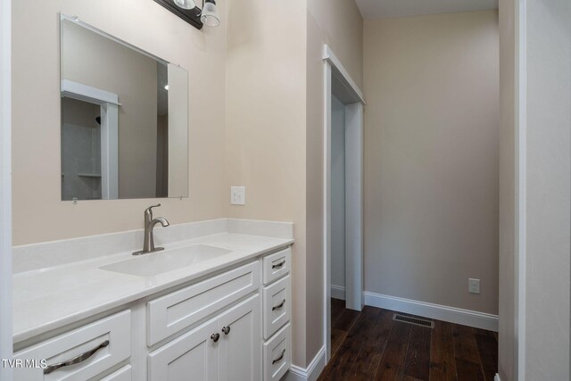 bathroom featuring vanity and hardwood / wood-style floors