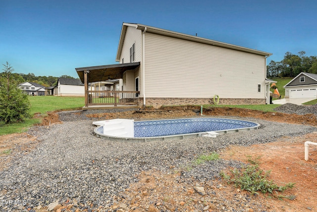 exterior space featuring a porch and a garage