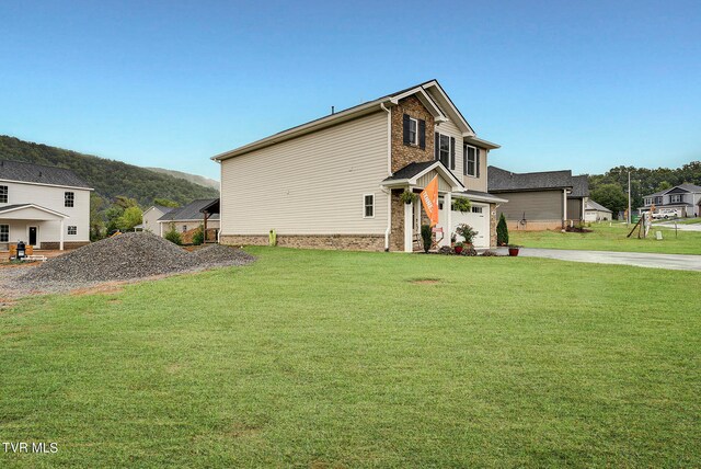 view of property exterior featuring a lawn and a garage