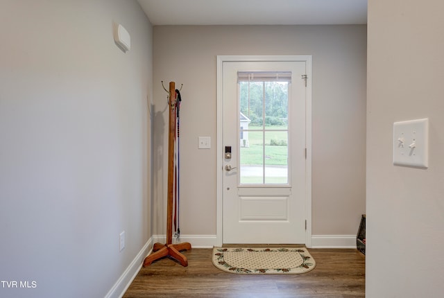 doorway to outside with dark hardwood / wood-style floors