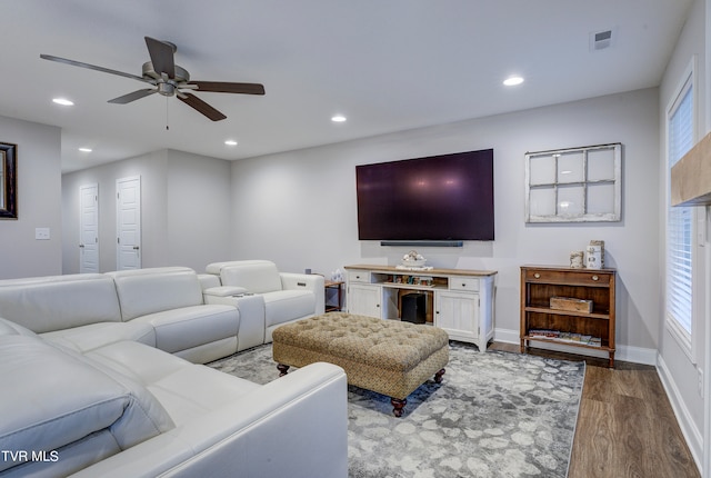 living room with ceiling fan and hardwood / wood-style flooring