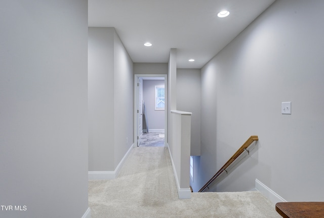 hallway with light carpet