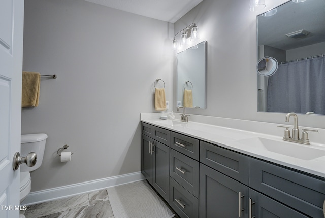 bathroom with vanity and toilet