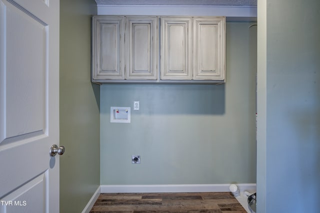 laundry area with hookup for a washing machine, dark hardwood / wood-style flooring, cabinets, and electric dryer hookup