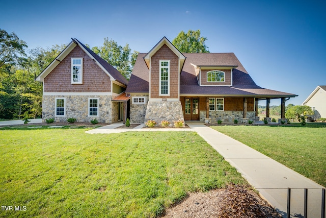 view of front of home with a front yard and a porch