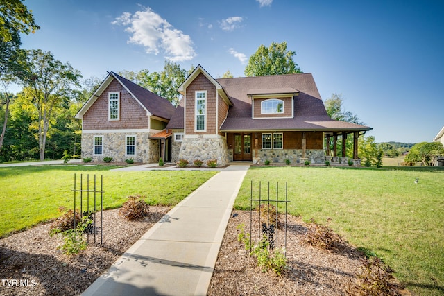 view of front of home with covered porch and a front yard