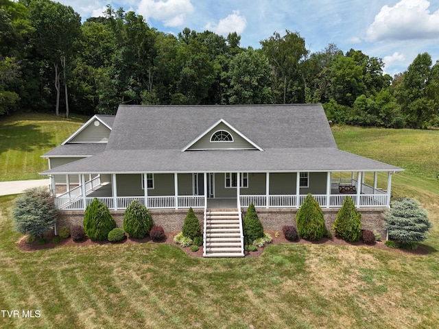 farmhouse inspired home featuring a front lawn and a porch