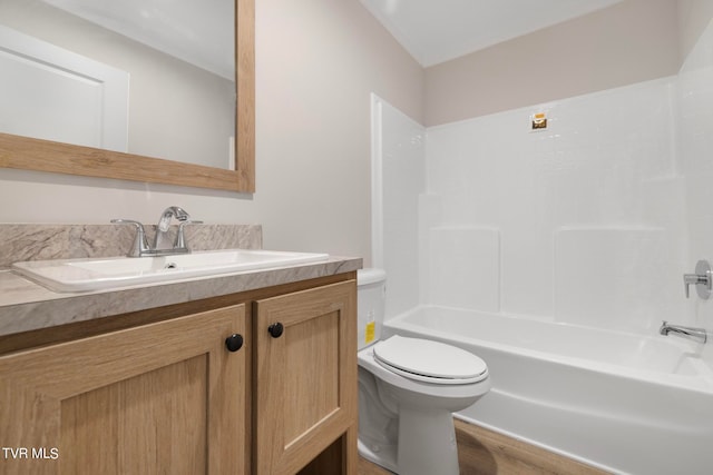 full bathroom featuring vanity, toilet, wood-type flooring, and shower / tub combination