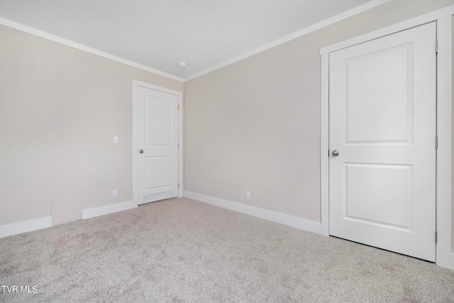 spare room with carpet and ornamental molding