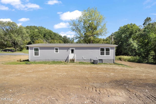 back of house with central AC