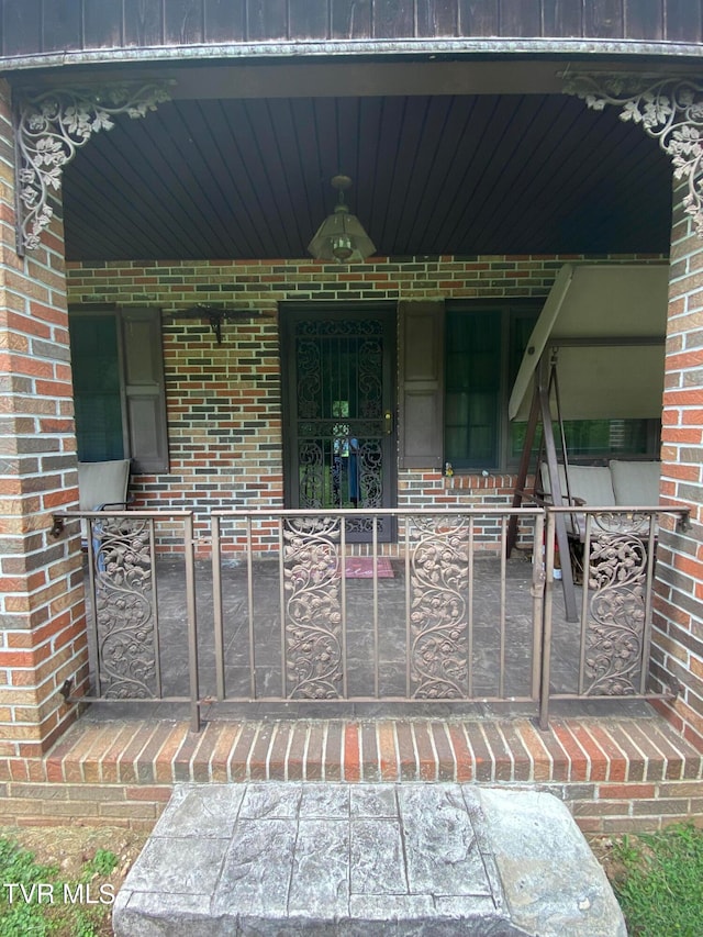 entrance to property with covered porch