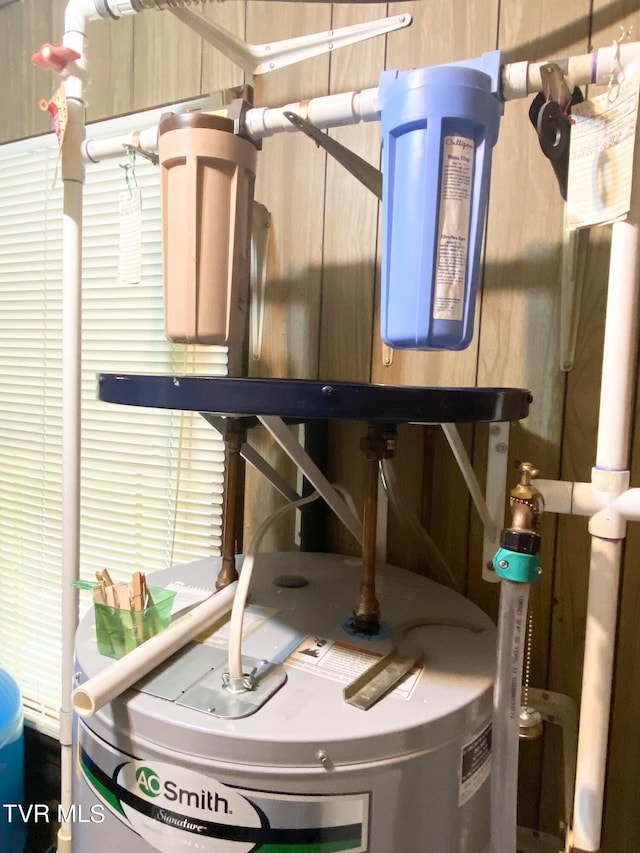 utility room with water heater