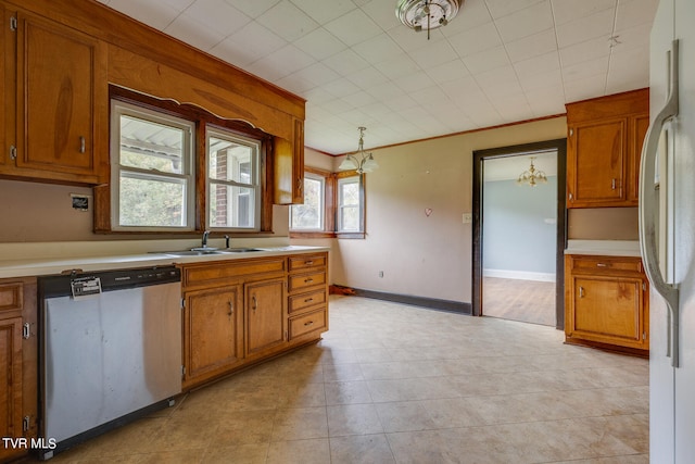 kitchen featuring dishwasher, pendant lighting, white fridge, and ornamental molding