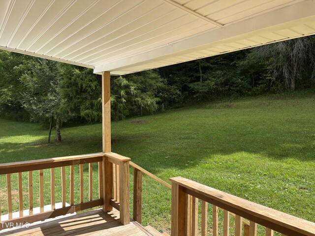 wooden deck with a yard