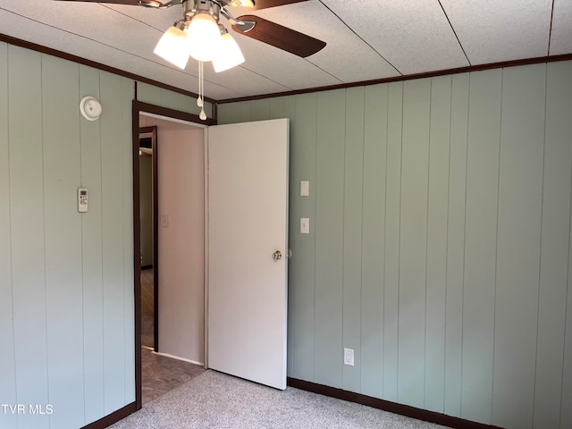 unfurnished bedroom with carpet flooring and ceiling fan