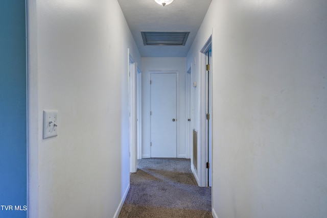 corridor featuring carpet flooring