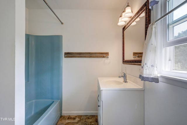 bathroom with shower / bath combination with curtain and vanity