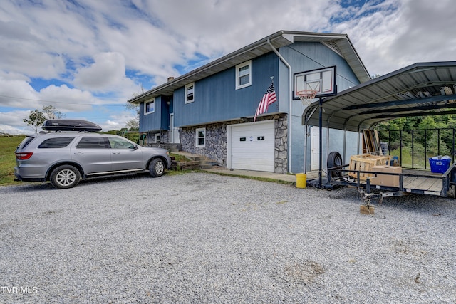 view of side of home featuring a carport and a garage