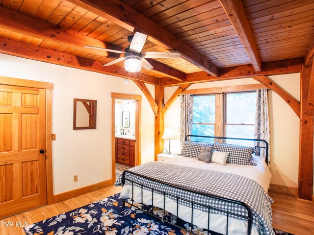 bedroom with ceiling fan, beam ceiling, light hardwood / wood-style floors, and wooden ceiling