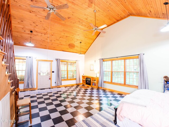 bedroom with ceiling fan, multiple windows, high vaulted ceiling, and wooden ceiling