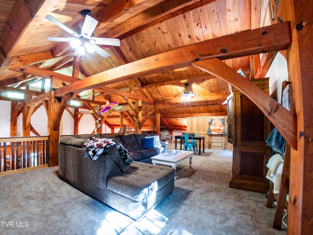 living room featuring carpet floors, wooden walls, vaulted ceiling with beams, ceiling fan, and wooden ceiling