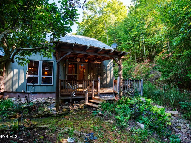 back of house featuring a deck