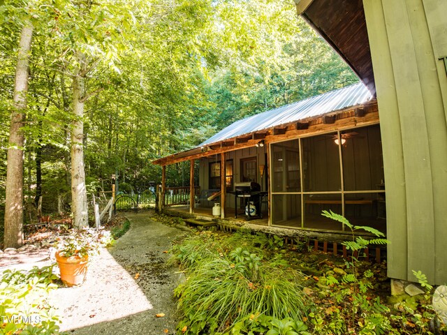 view of yard with a sunroom