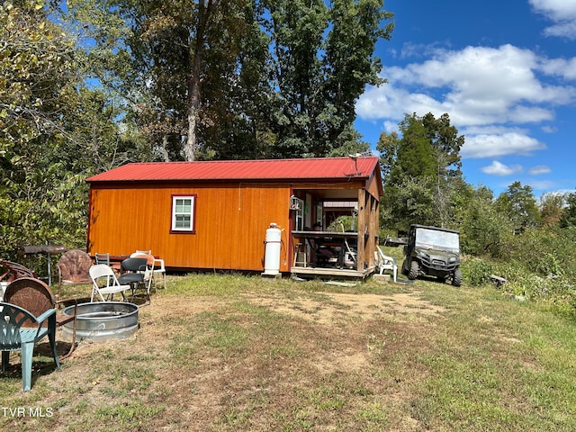 view of outbuilding with a lawn