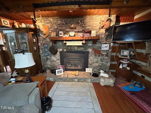 living room featuring wood-type flooring and wooden ceiling