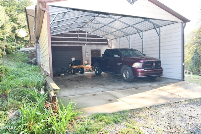 view of car parking featuring a garage and a carport