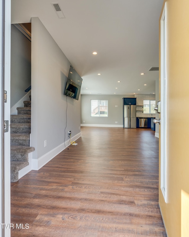 unfurnished living room with hardwood / wood-style flooring