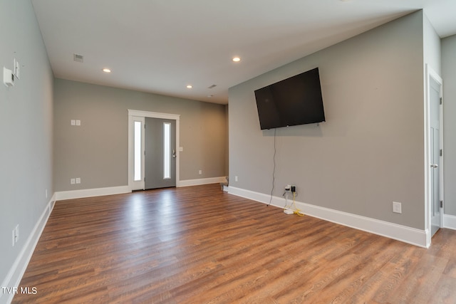 unfurnished living room with light wood-type flooring